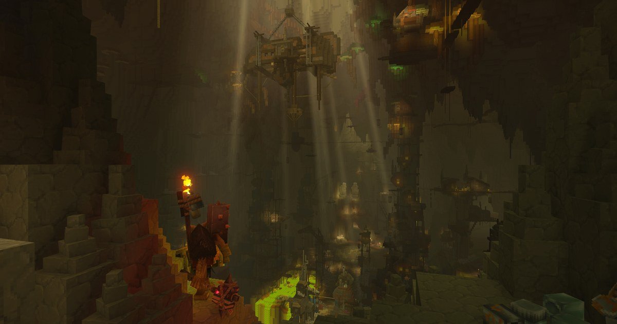 مغارة واسعة مضاءة بالمشاعل مع منصات خشبية معلقة في لعبة Hytale